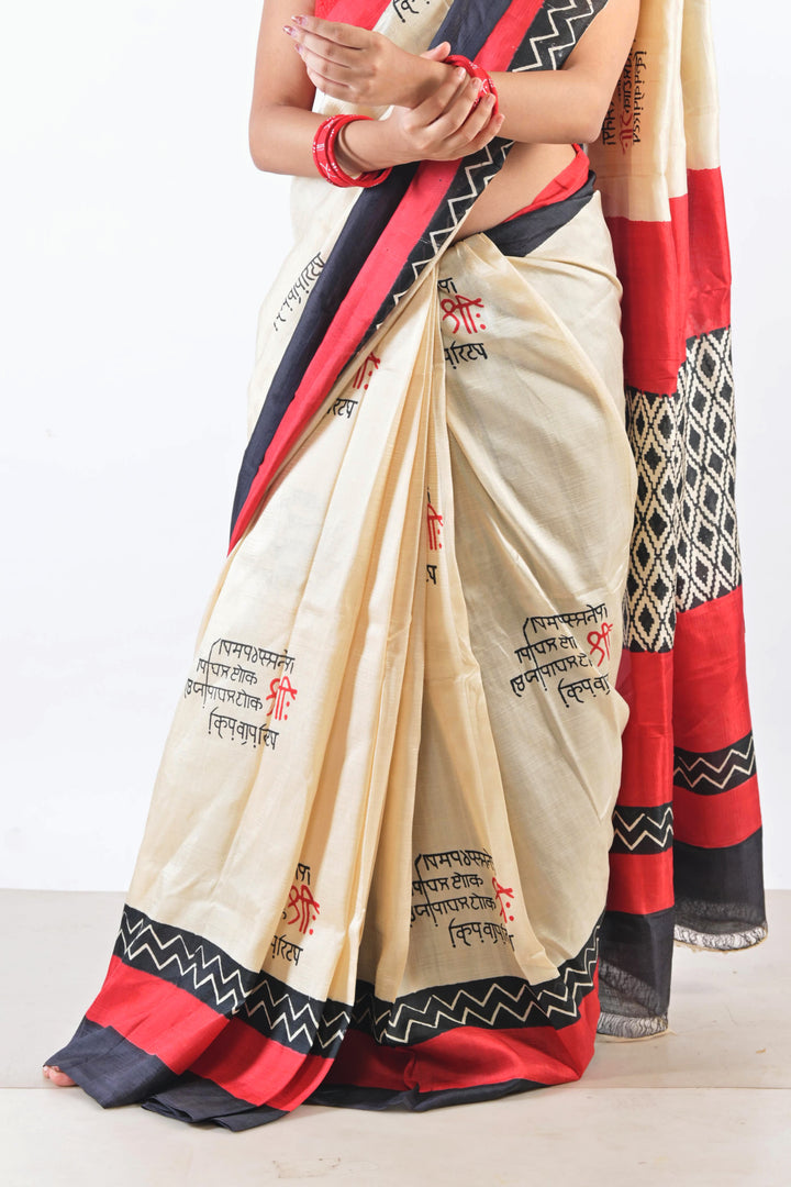 Off white with the combination of Red & Black Saree