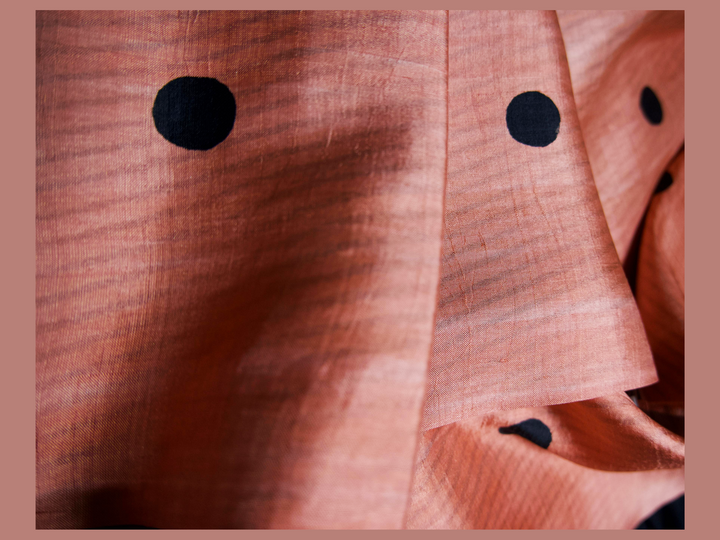Peach with black polka dots